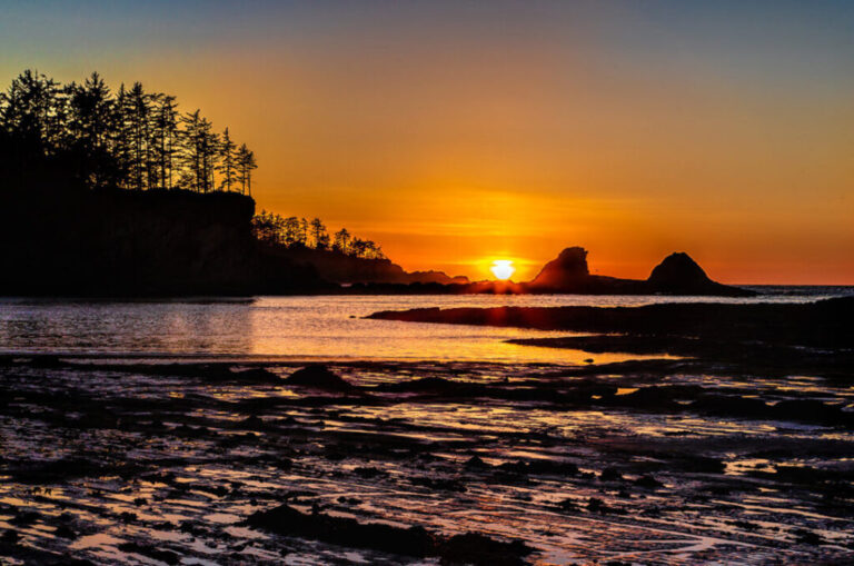 Sun setting at Sunset Bay State Park near Coos Bay Oregon