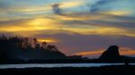 The sun sets in Sunset Bay State Park near Coos Bay, Oregon on the southern Oregon Coast