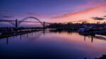 Yaquina Bay bridge and harbor at sunset in Newport, Oregon Coast