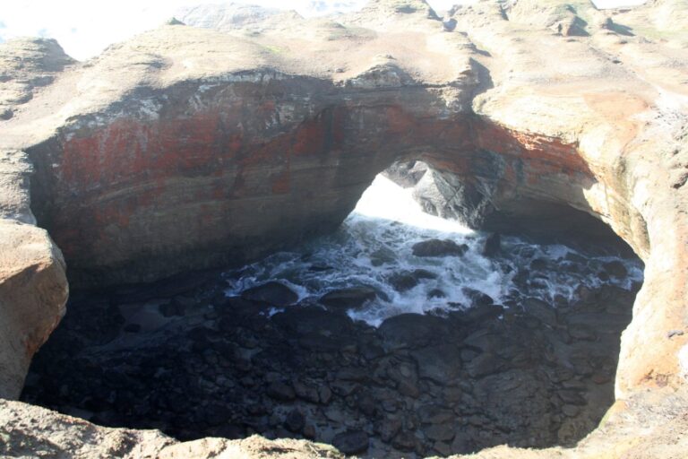 Devil's Punchbowl fills with water at high tide on the Oregon Coast