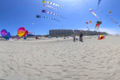 Colorful kites flying on the beach for the annual summer kite festival in Lincoln City Oregon coast