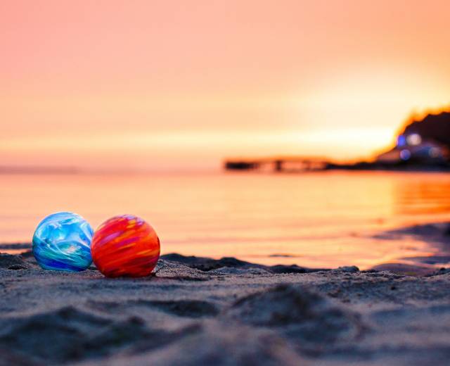 Colorful glass floats are left on the beach as part of the Finders Keepers program in Lincoln City, Oregon
