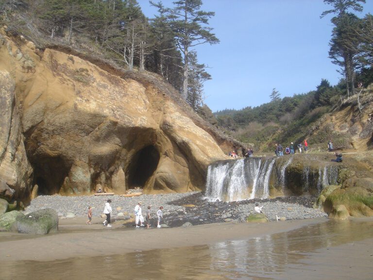 Hug Point waterfall near Cannon Beach on the Oregon Coast with beach coves