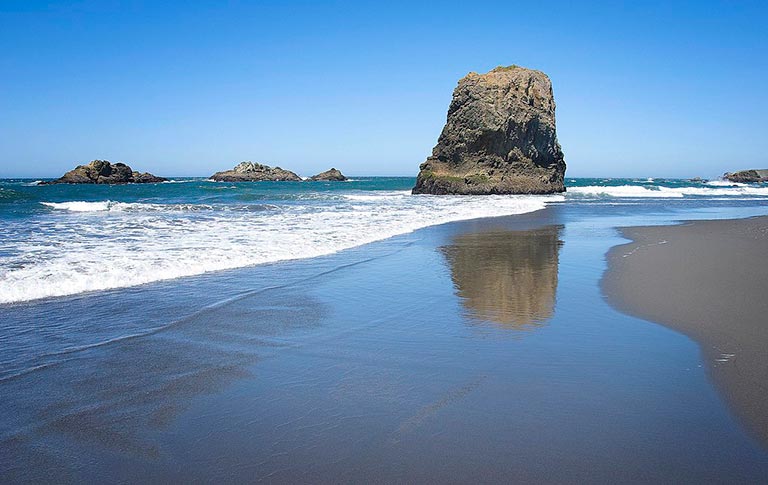 The sandy beach at Pistol River State Scenic Viewpoint near Gold Beach, Oregon