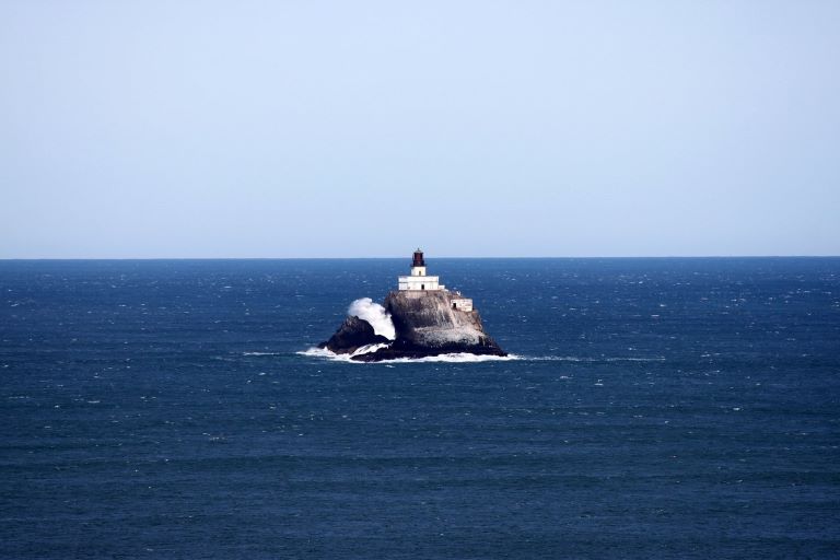 Tillamook Rock Lighthouse sits alone on a rock in the middle of the Pacific off the coast south of Seaside, Oregon and north of Cannon Beach