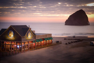Pelican Brewing on the beachfront with Haystack Rock in the background at sunset in Pacific City, Oregon Coast