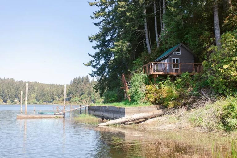 A secluded, boat-in-only tiny cabin vacation rental on a lake near Reedsport, Oregon
