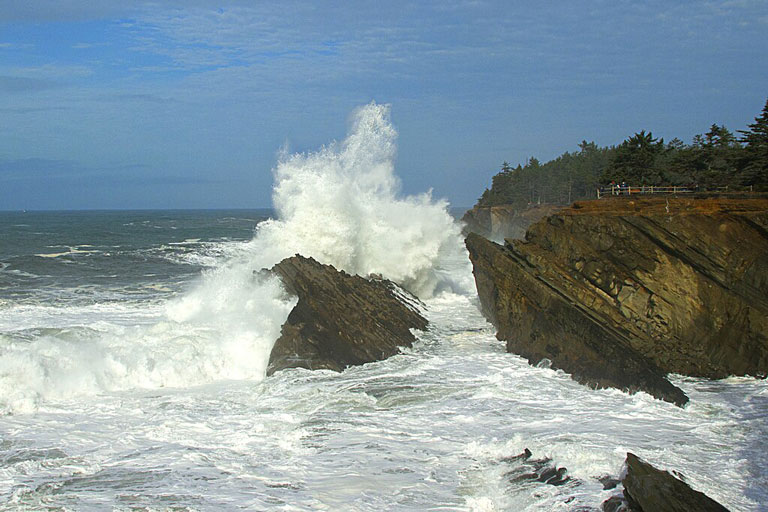 Huge King Tide waves crash against the rocks at Shore Acres State Park near Coos Bay, Oregon