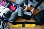 Packing for winter travel with packing cubes in carry-on luggage