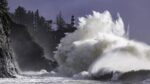 Huge Storm waves at Cape Disappointment State Park lighthouse near Long Beach, Washington