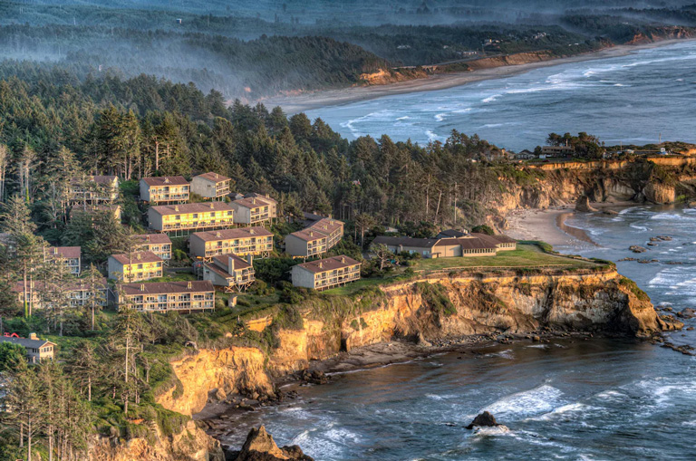 The Inn at Otter Crest oceanfront hotel sits on a cliff overlooking the ocean south of Depoe Bay, Oregon