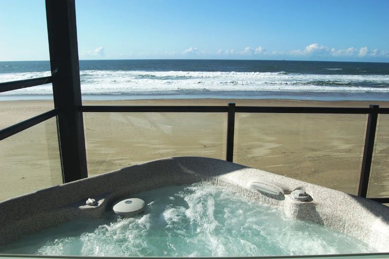 Beachfront Manor is one of the best Oregon Coast hotels with hot tub on balcony overlooking the ocean in Lincoln City, OR