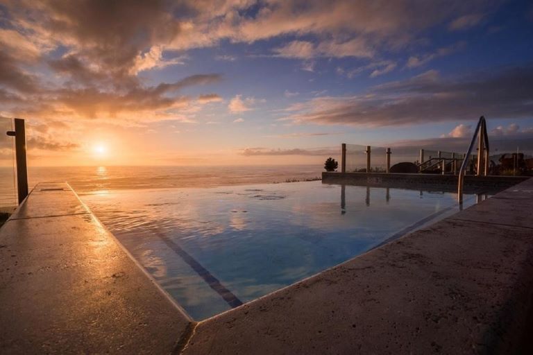 The Inn at Nye Beach in Newport, Oregon is one of the best romantic hotels on the Oregon Coast with its infinity spa overlooking the ocean