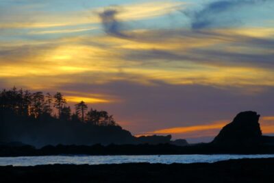 The sun sets in Sunset Bay State Park near Coos Bay, Oregon on the southern Oregon Coast