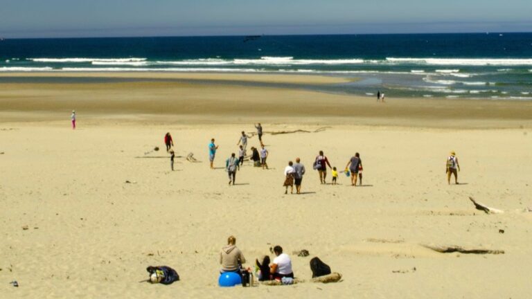 People on the beach on the Oregon Coast in summer, South Beach near Newport, Oregon