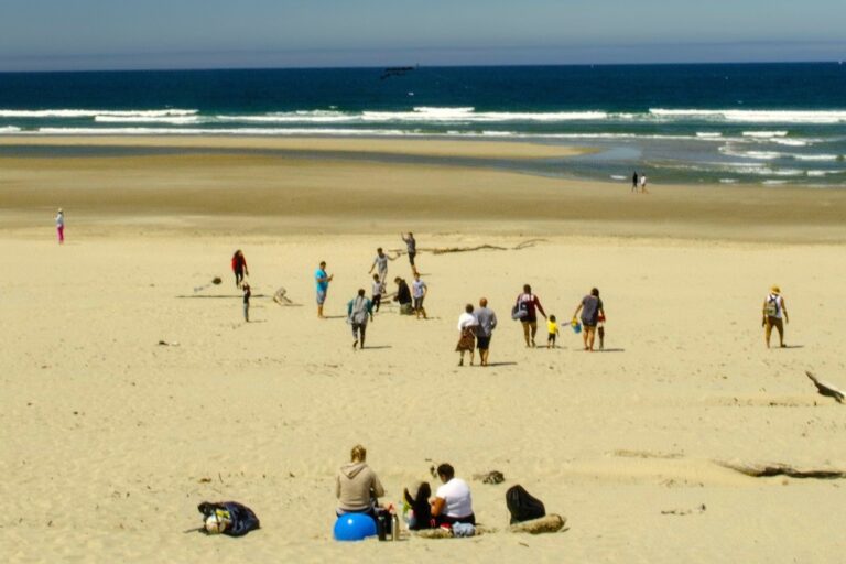 People on the beach on the Oregon Coast in summer, South Beach near Newport, Oregon