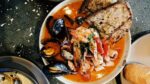 A plate of fresh seafood illustrating the top restaurants on the central Oregon Coast