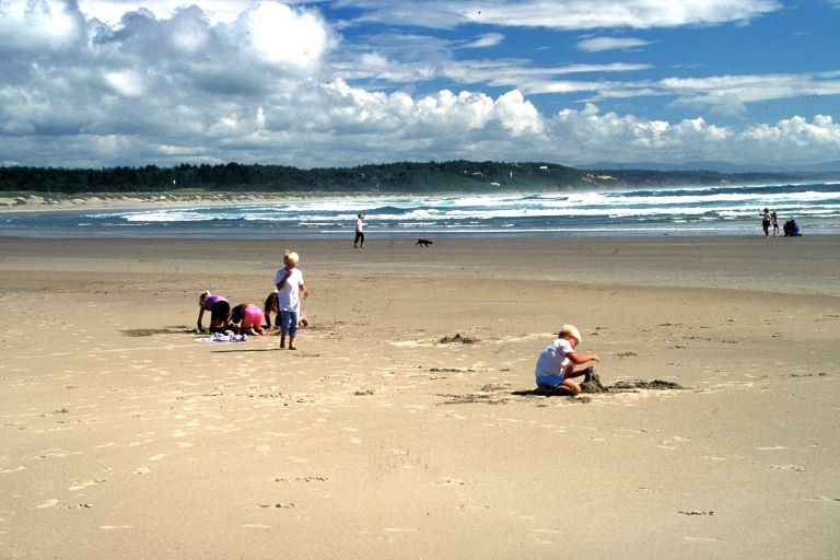 Kids build sandcastles at South Beach State Park in Newport, Oregon Coast